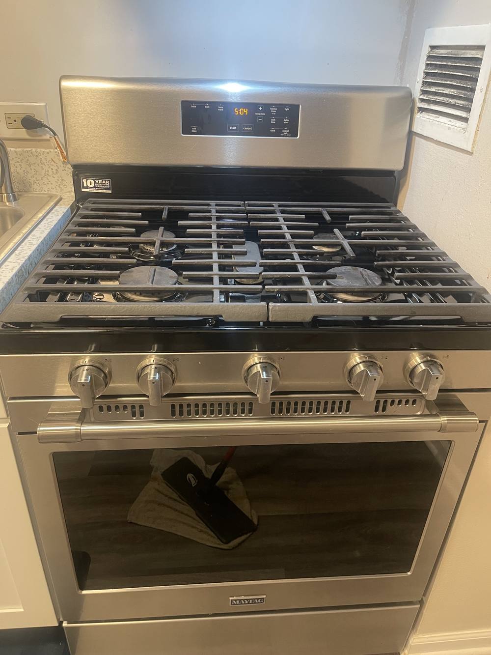 Stainless steel gas range cleaned and polished