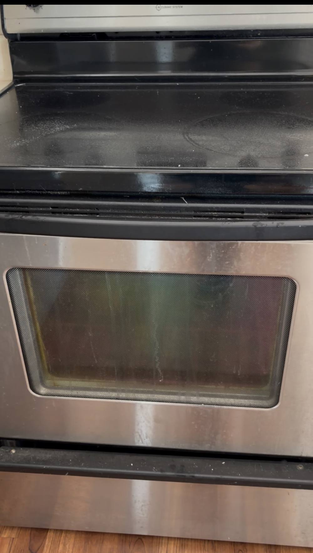 Range exterior with greasy oven door and smudged cooktop